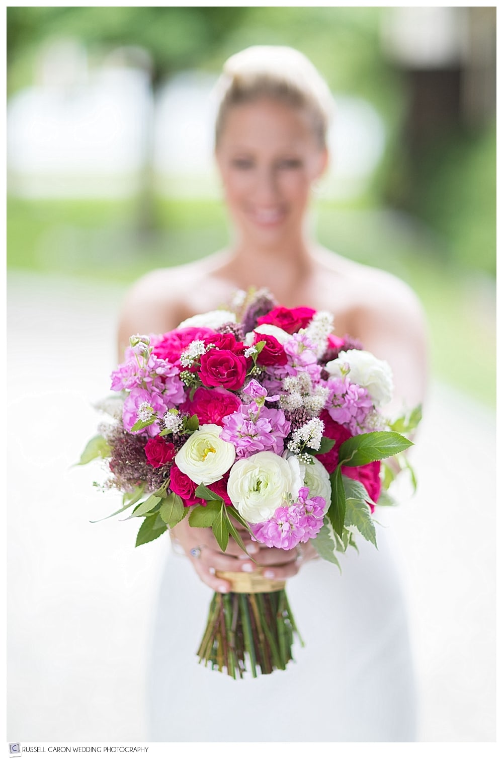 bride holding out beautiful bouquet