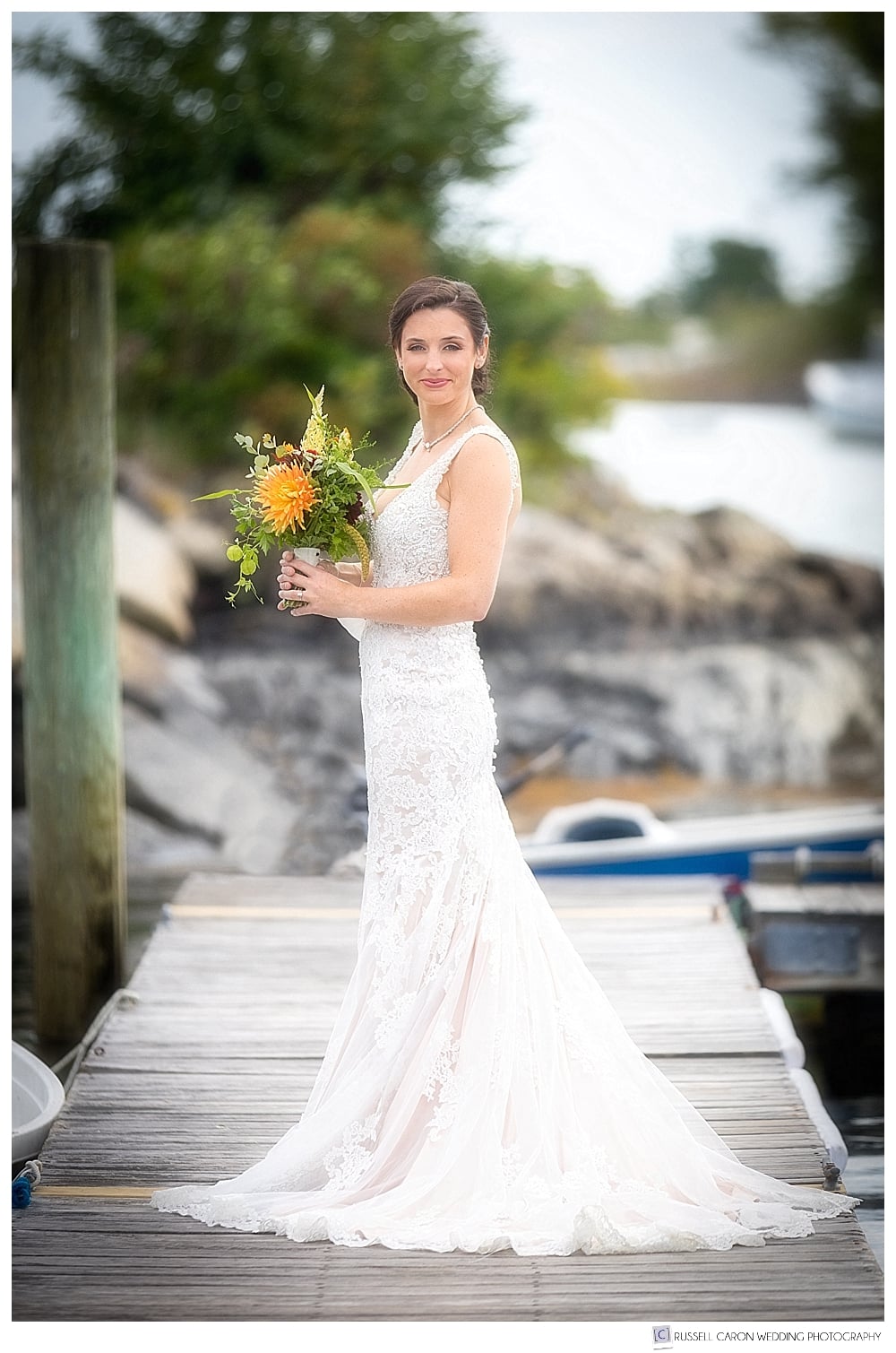bride standing on the dock at the Nonantum Resort, Kennebunkport, Maine