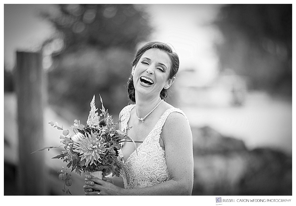 black and white photo of bride laughing