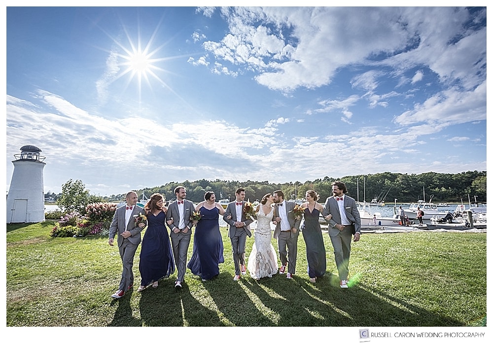 bridal party walking arm in arm at the Nonantum Resort, Kennebunkport
