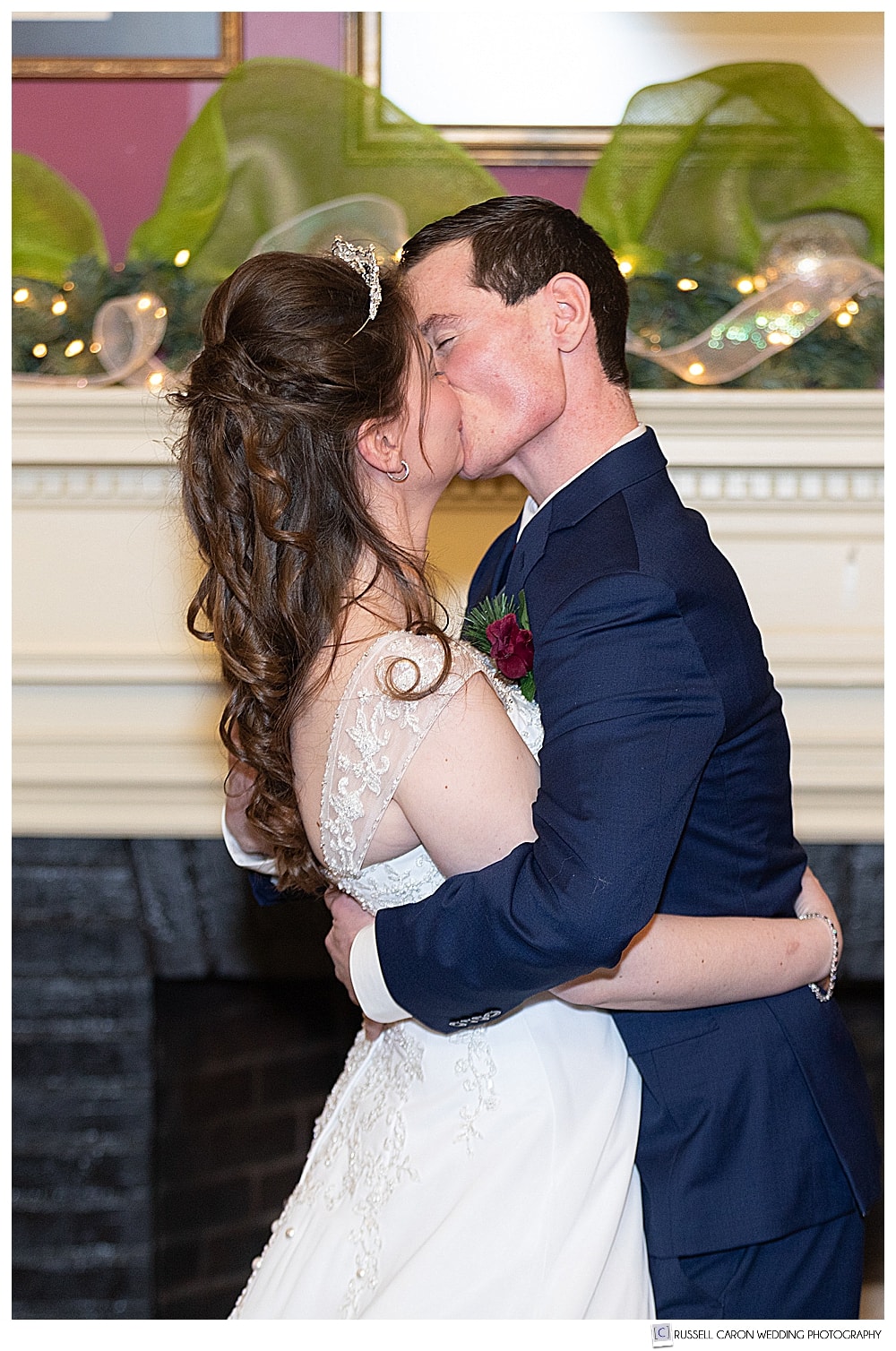 bride and groom's first kiss at their Bethel Maine wedding ceremony