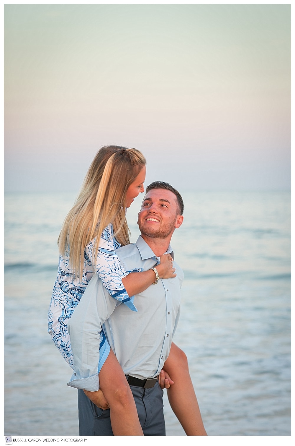 engaged couple at the beach at biddeford pool maine
