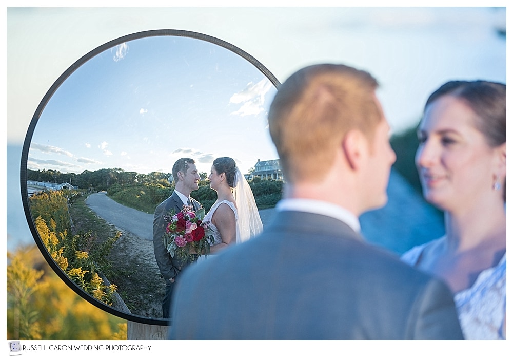 bride and groom's reflection in mirror
