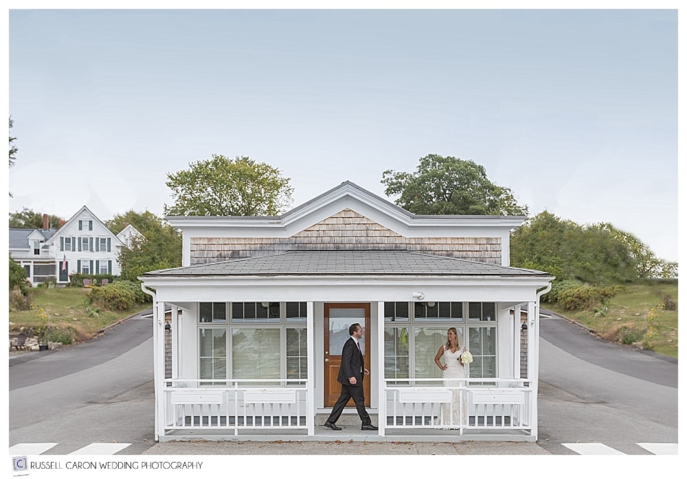 bride and groom on porch of tiny house