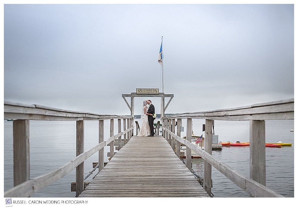 bride and groom on Spruce Point Inn dock