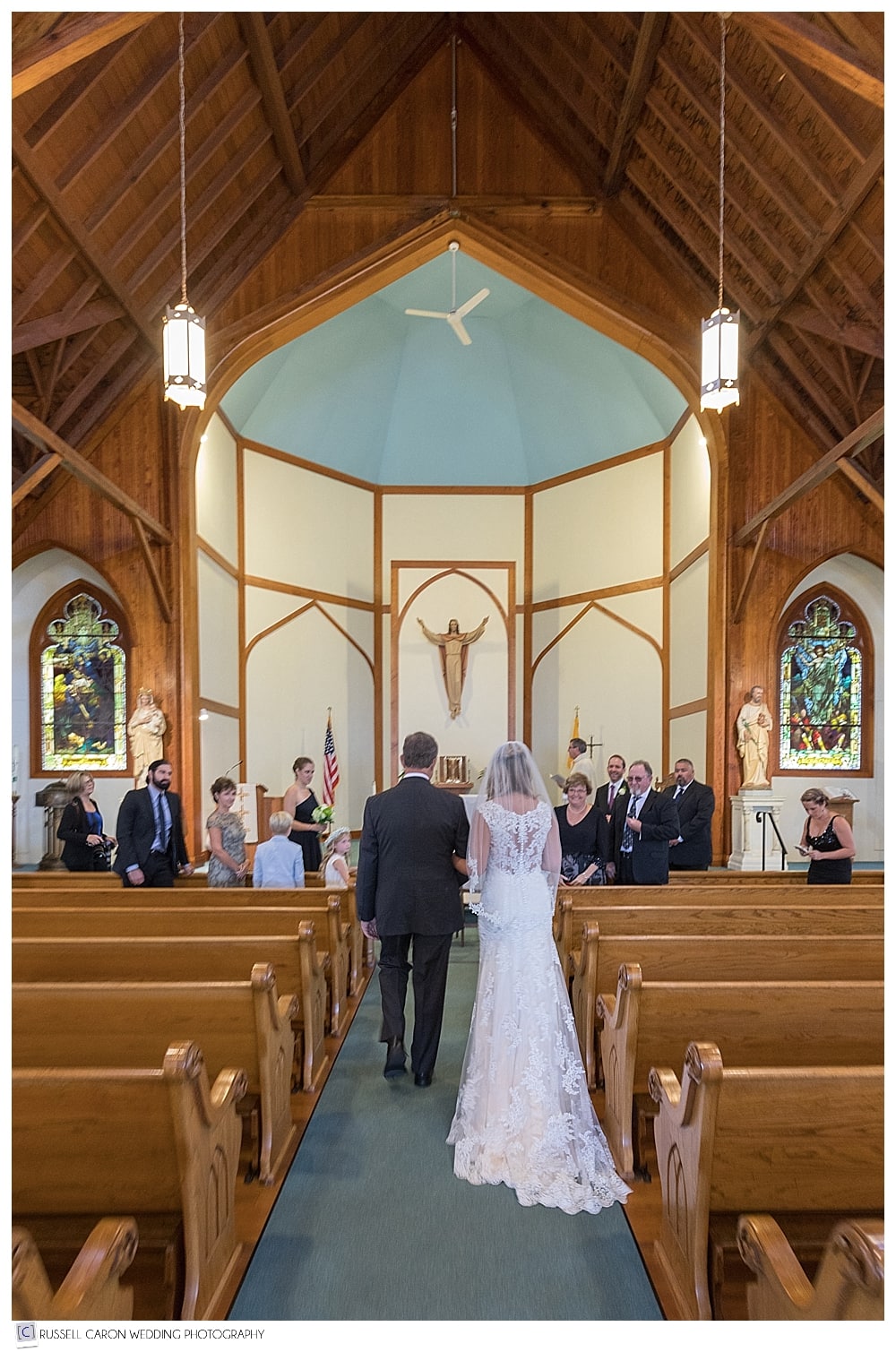 Bride and her father reach the altar at Our Lady Queen of Peace wedding