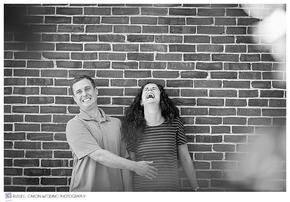 man and woman laughing