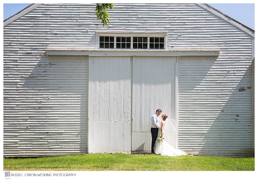 bride-and-groom-in-front-of-a-barn