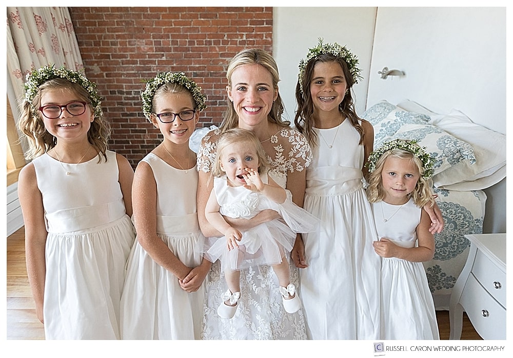 beautiful bride with flower girls