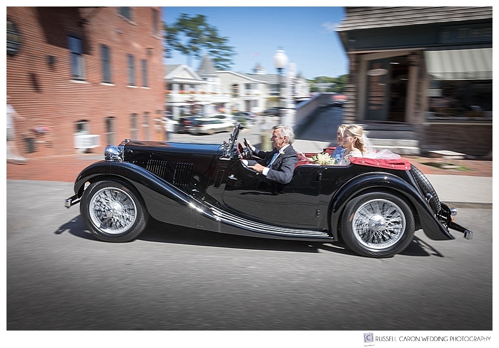 antique convertible with bride in back seat in Camden, Maine