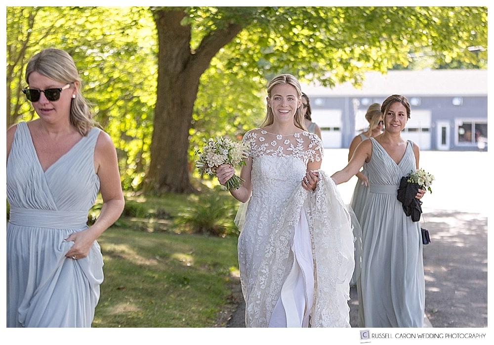 bride walking down the street with bridesmaids