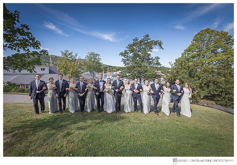 bridal party walking arm in arm in Camden Maine