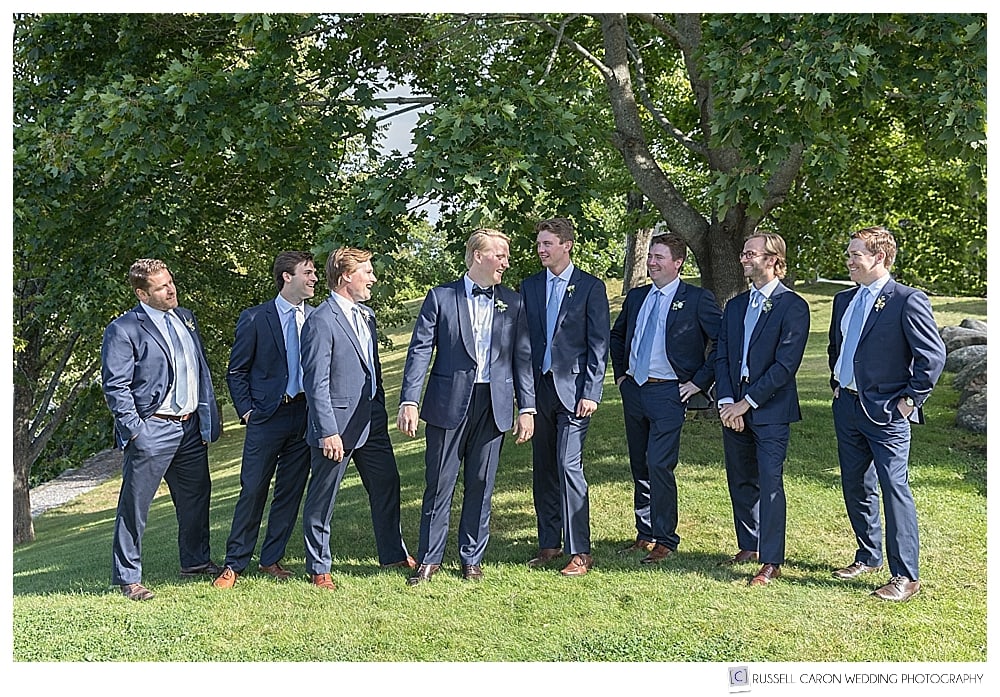 groom and groomsmen standing together