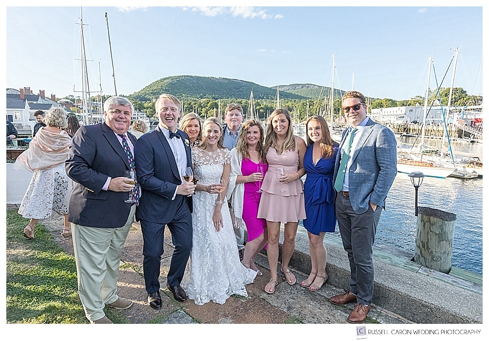 bride posing with wedding guests in Camden, Maine