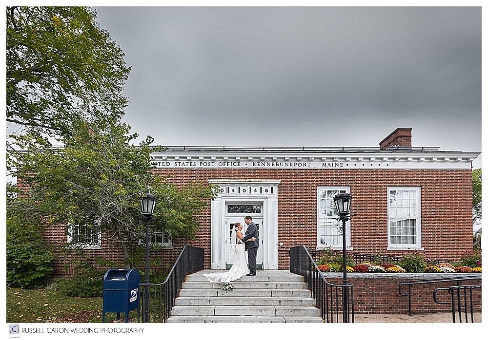 bride and groom kissing on the steps of the Kennebunkport Maine Post Office