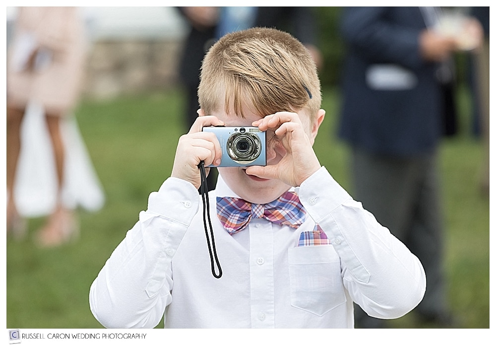 young wedding guest with camera