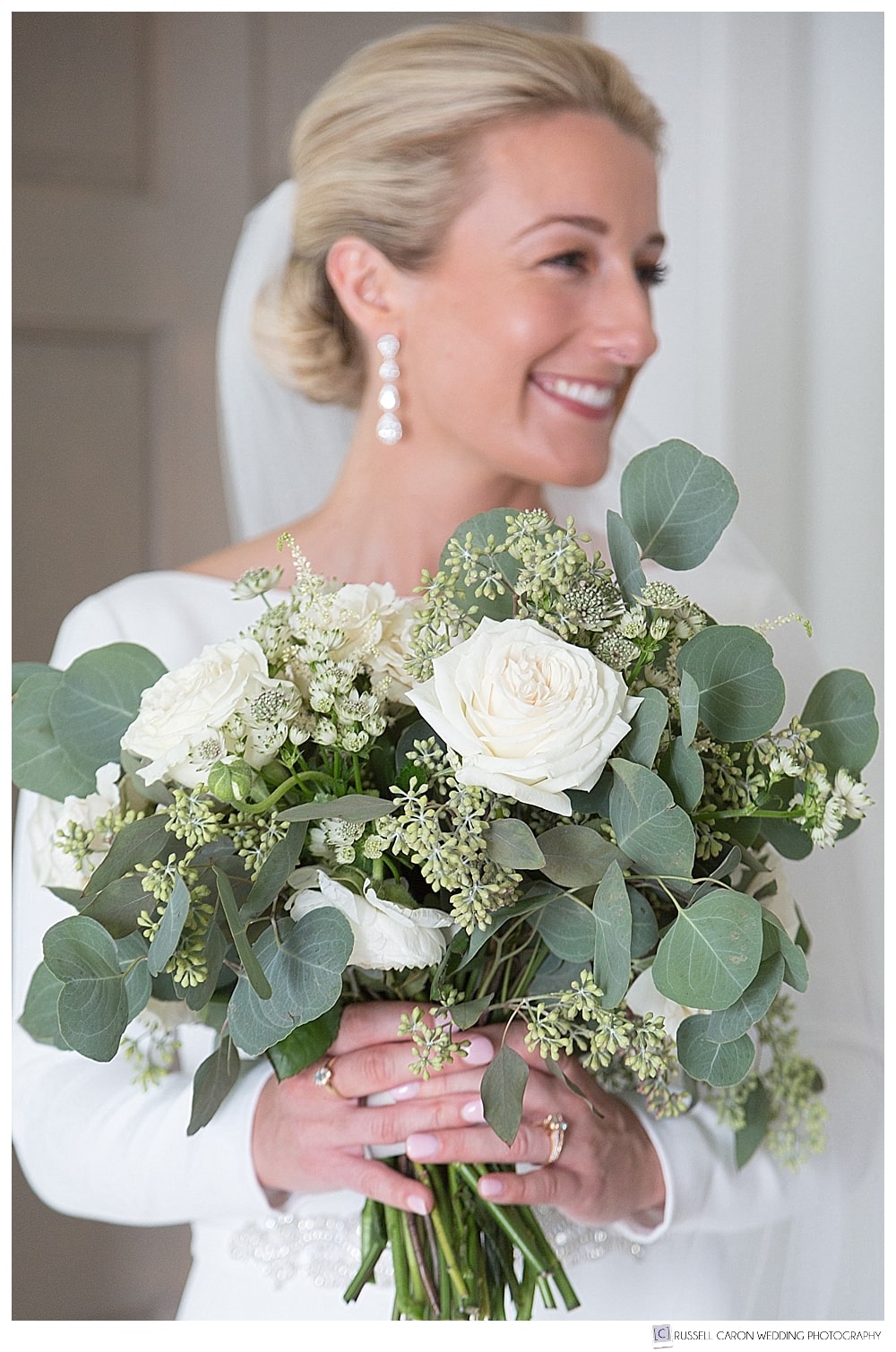 bride with white and green bouquet
