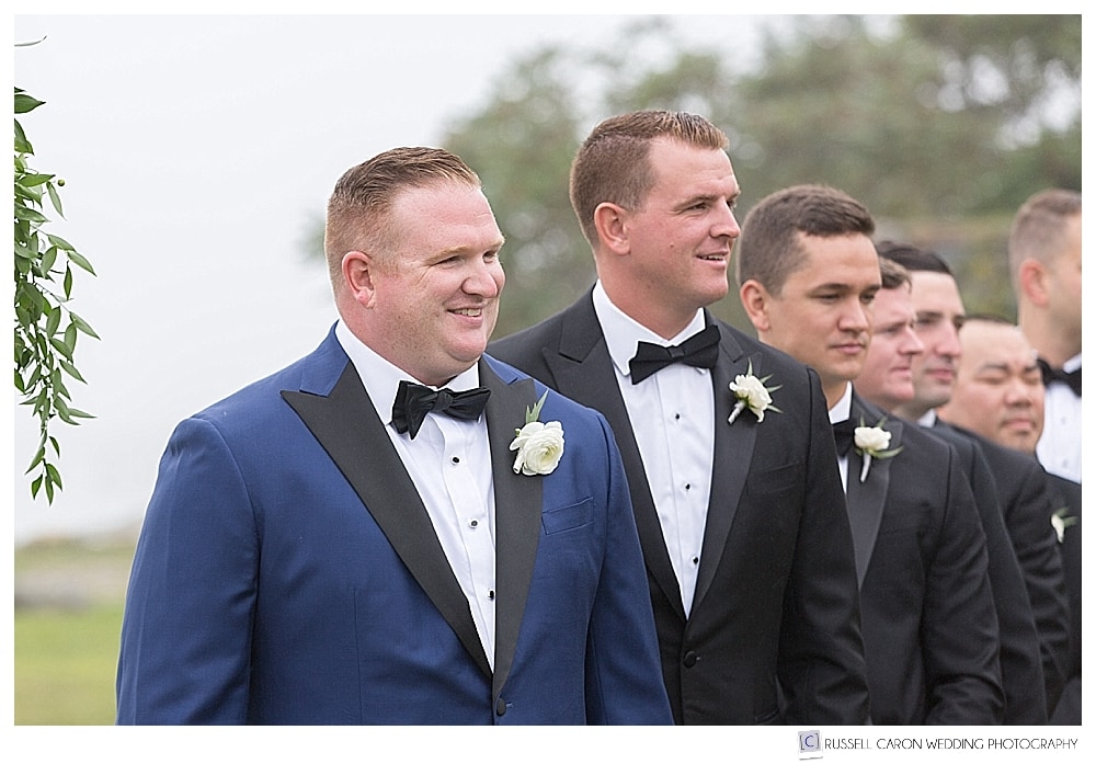 groom and groomsmen waiting for the bride