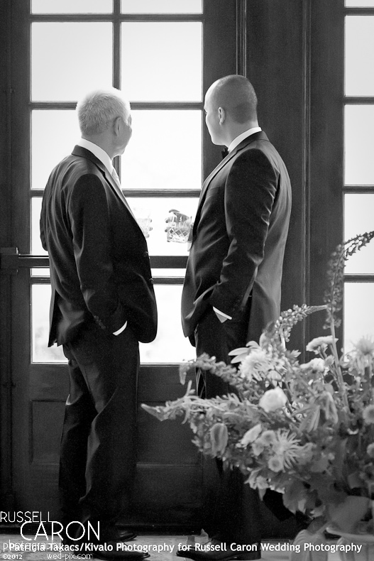 Groom looking out a window at French's Point