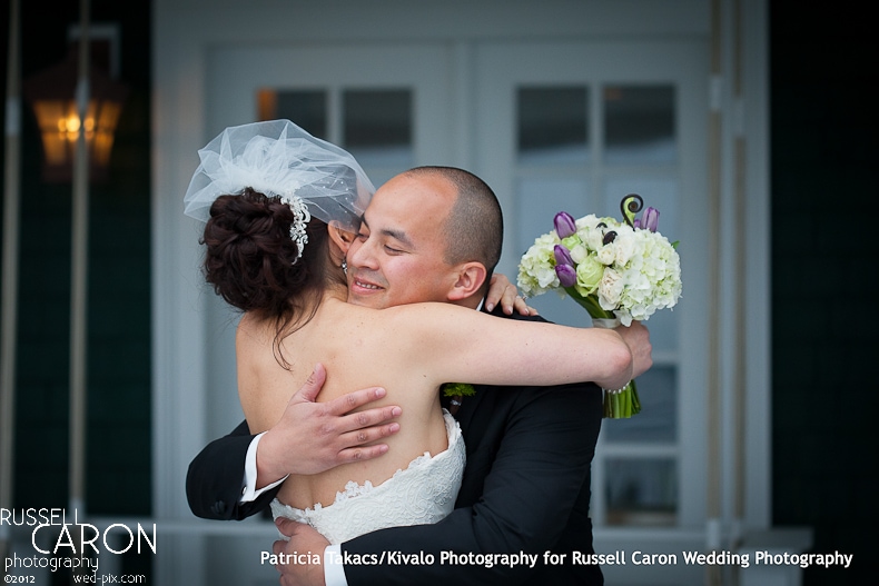 Bride and groom hugging at their wedding day first look