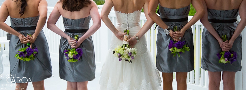 Bride and bridesmaids photo, back to with bouquets