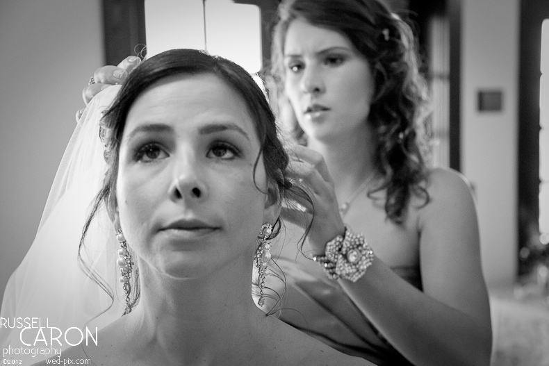 Bride getting her veil put on