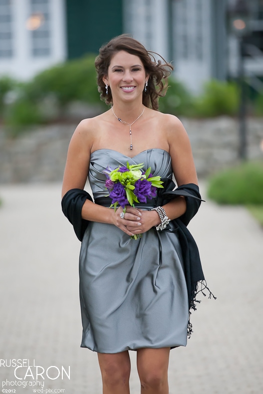 Bridesmaid during wedding ceremony processional at French's Point, Maine