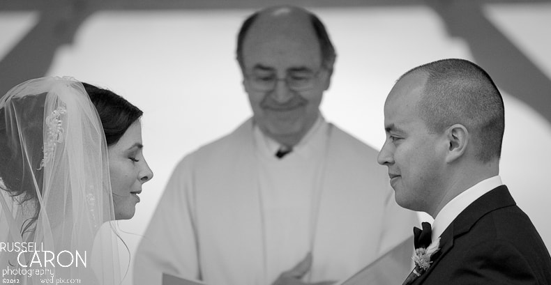 Bride and groom during wedding ceremony vows