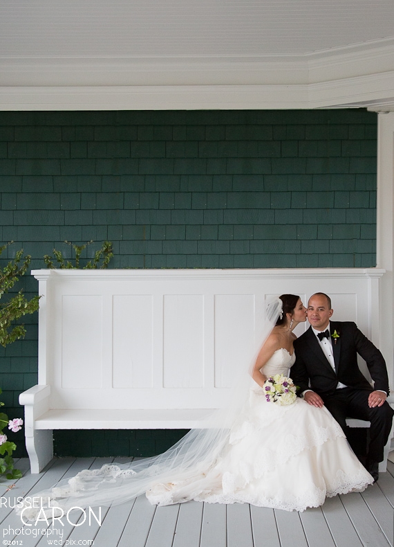 Bride and groom on the front porch at a French's Point wedding