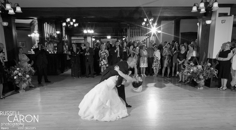 Groom dipping bride during first dance