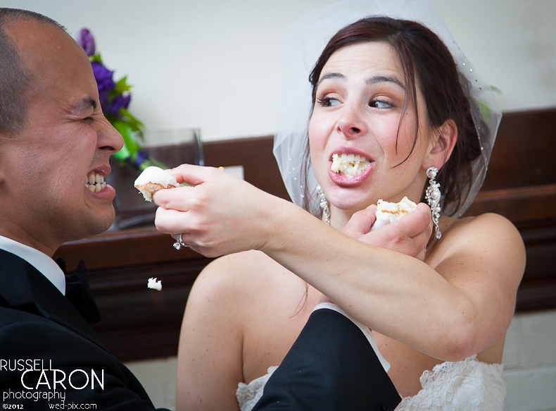 Bride feeding the groom cake