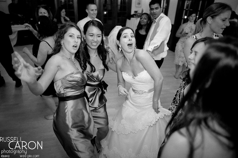 Bride and bridesmaid dancing