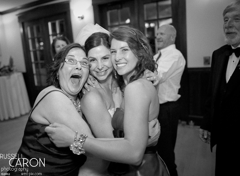 Bride and friends dancing