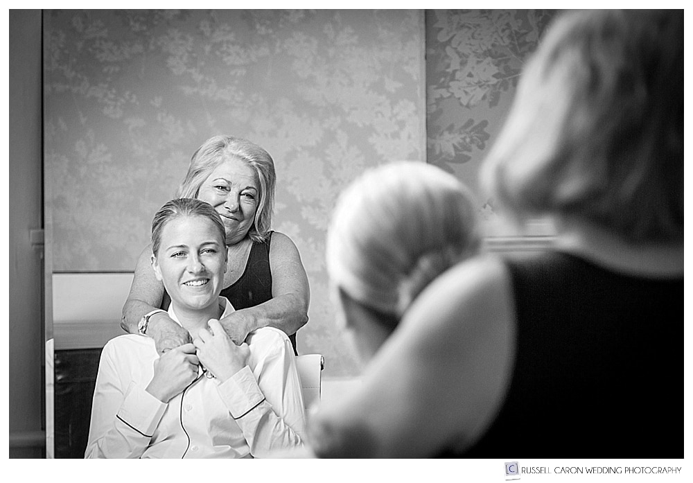 bride and her mother reflected in a mirror, colony hotel maine wedding photography