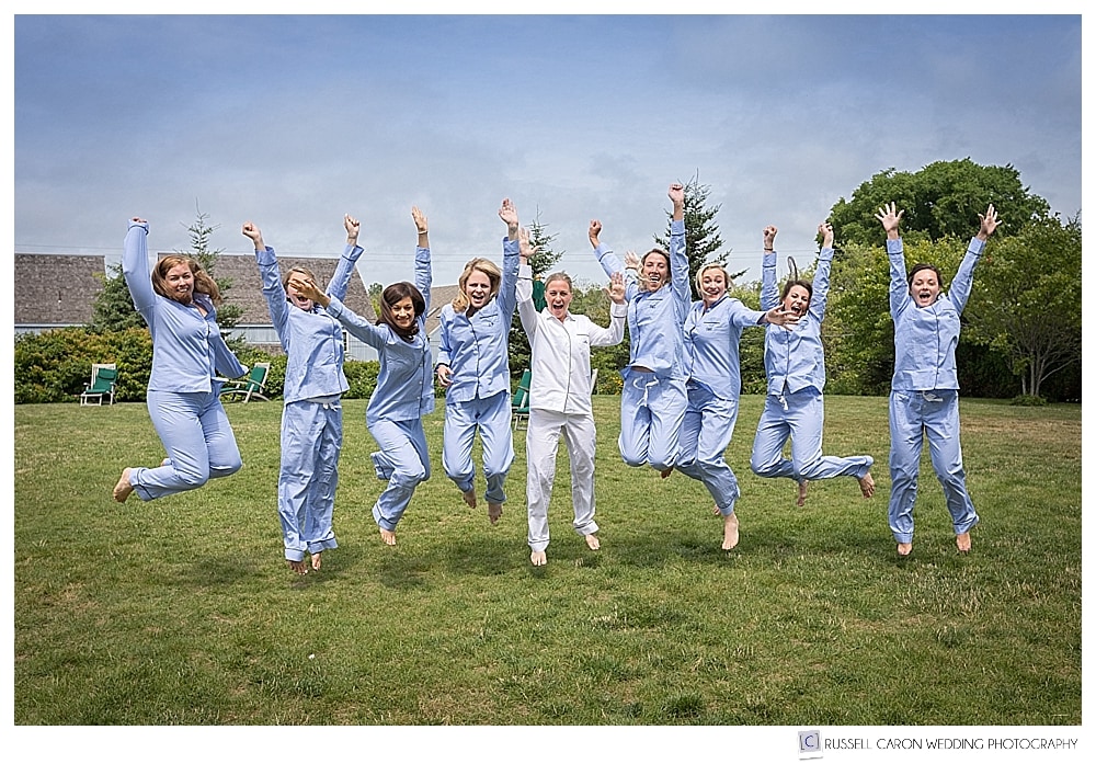 bride and bridesmaids, wearing pajamas, jumping in the air