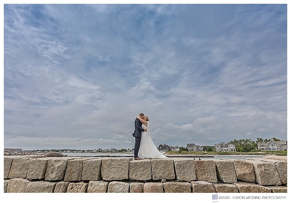 photo of bride and groom on the kennebunkport breakwater, kennebunkport, maine