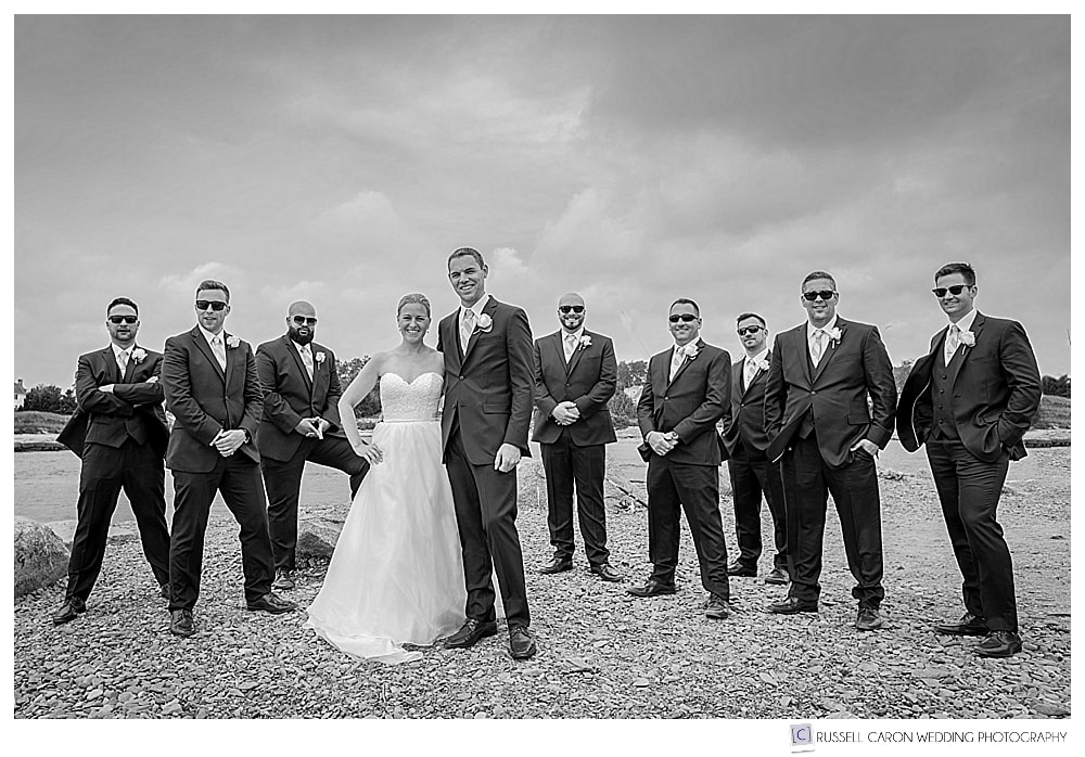 bride and groom with groomsmen wearing sunglasses