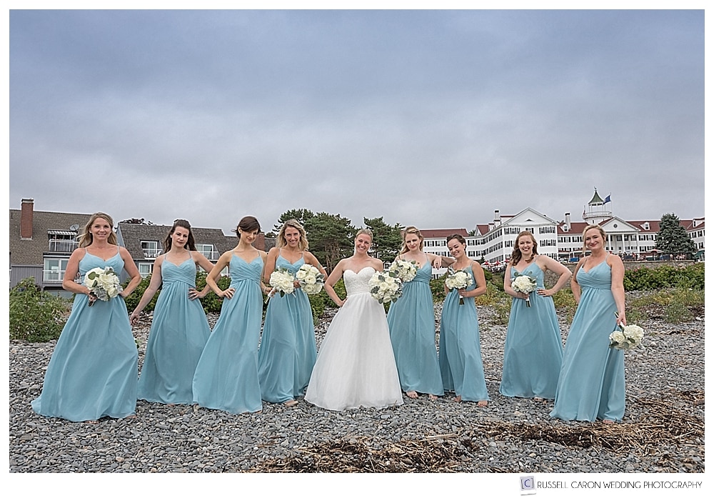 bride with bridesmaids wearing beautiful baby blue dresses