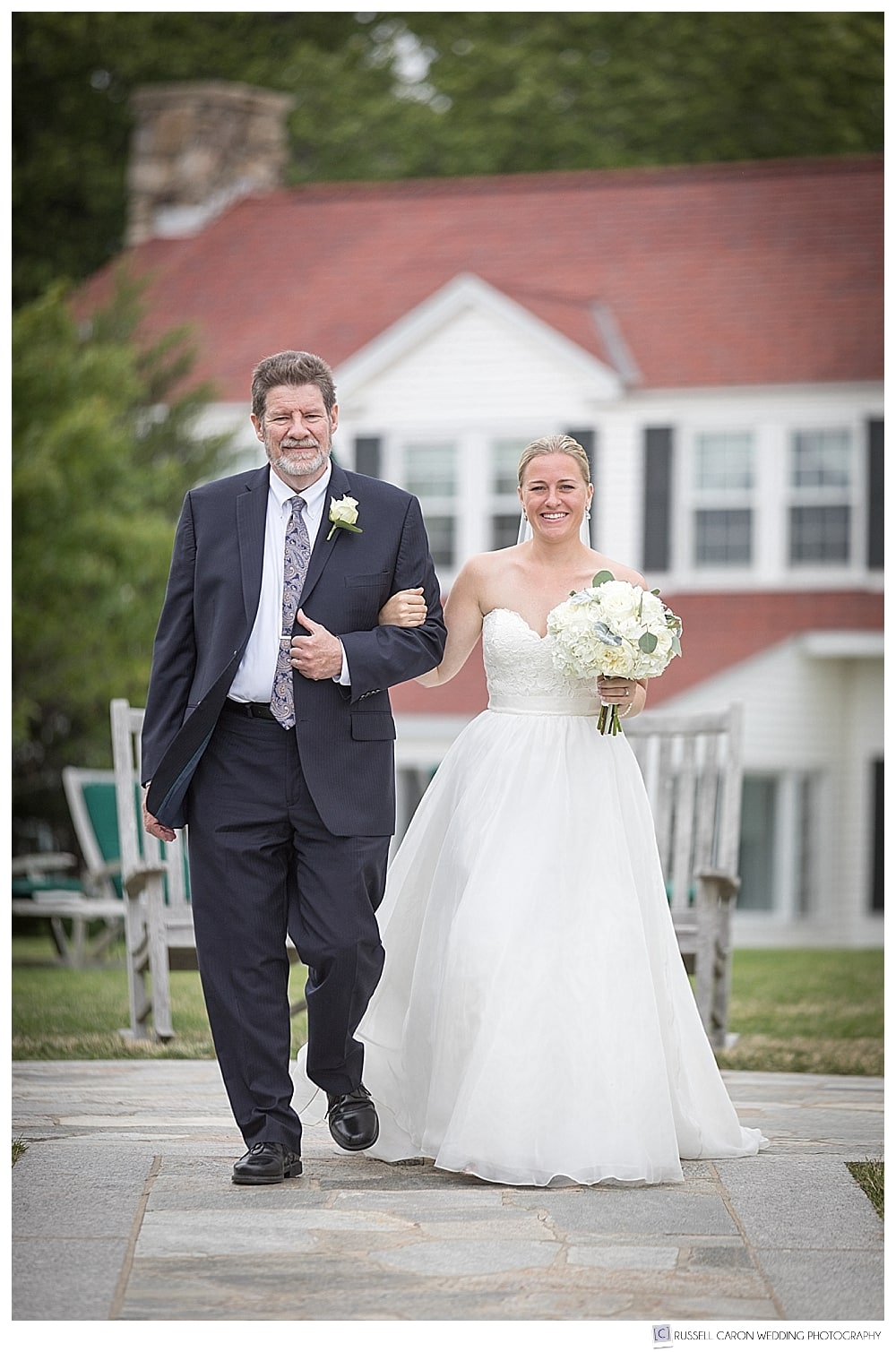 bride and her father walk down the aisle at the Colony Hotel Kennebunkport Maine wedding 