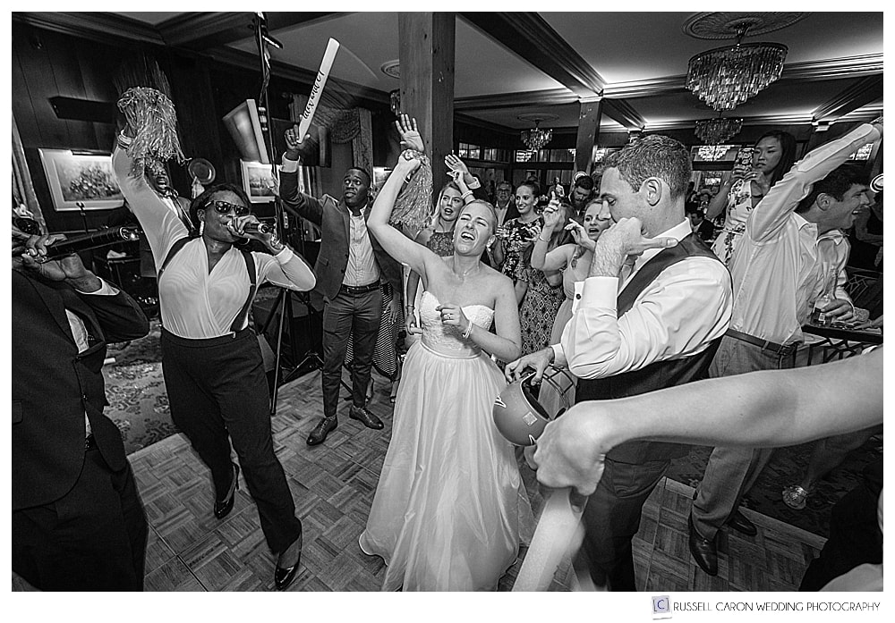 bride dancing and singing at her wedding reception in Kennebunkport, Maine