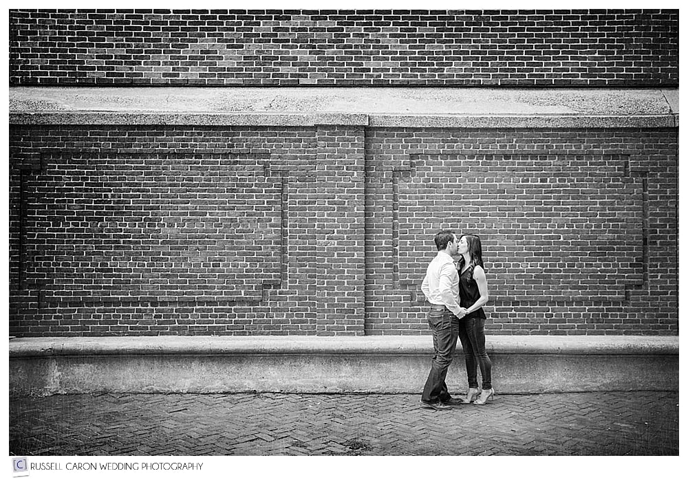 couple-kissing-in-front-of-brick-wall-boston