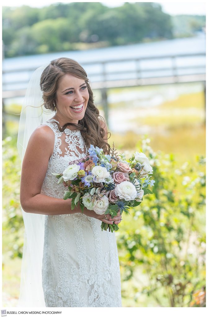 bride smiling during her wedding day first look photos