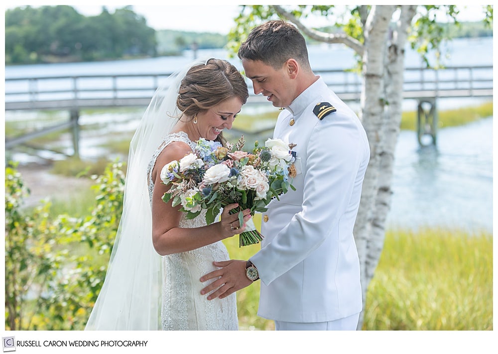 bride and groom in dress whites, at their wedding day first look