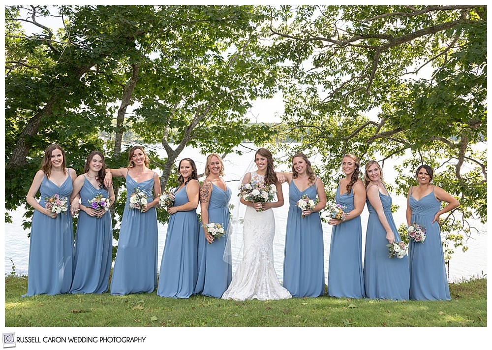 bride in white, with bridesmaids in light blue, at Fort Edgecomb, Edgecomb, Maine