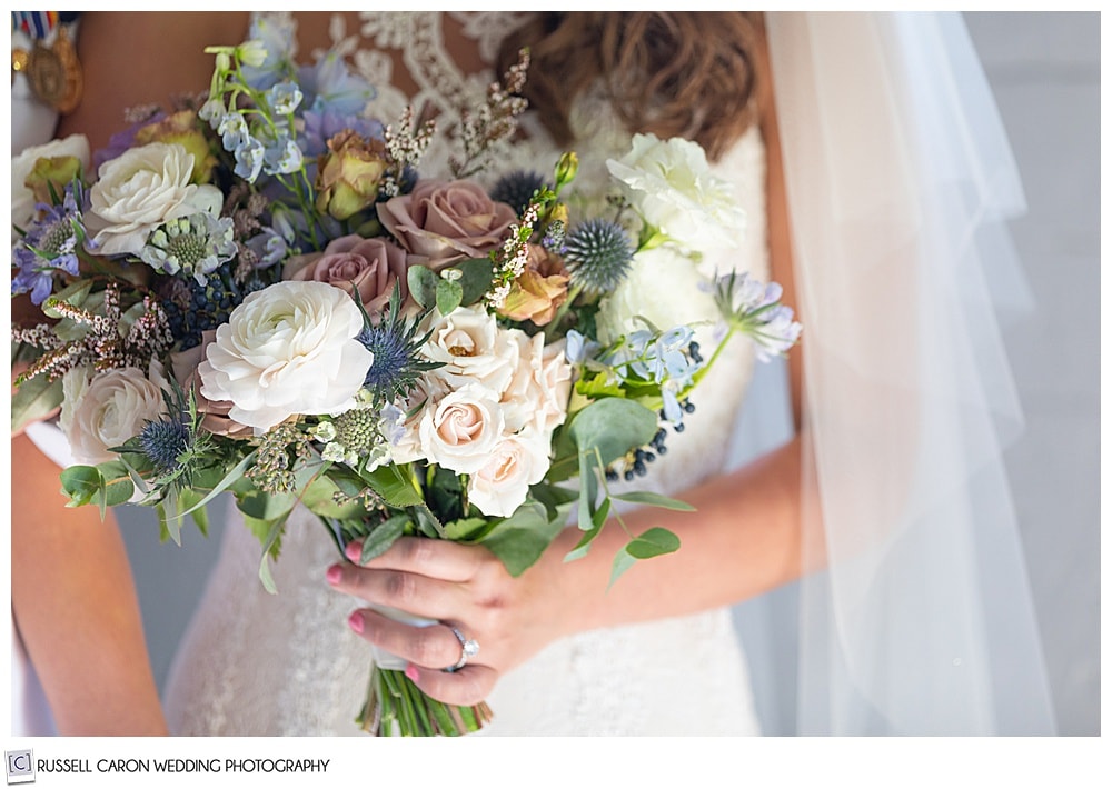 bride holding a beautiful bouquet by Honeysuckle Way Flowers