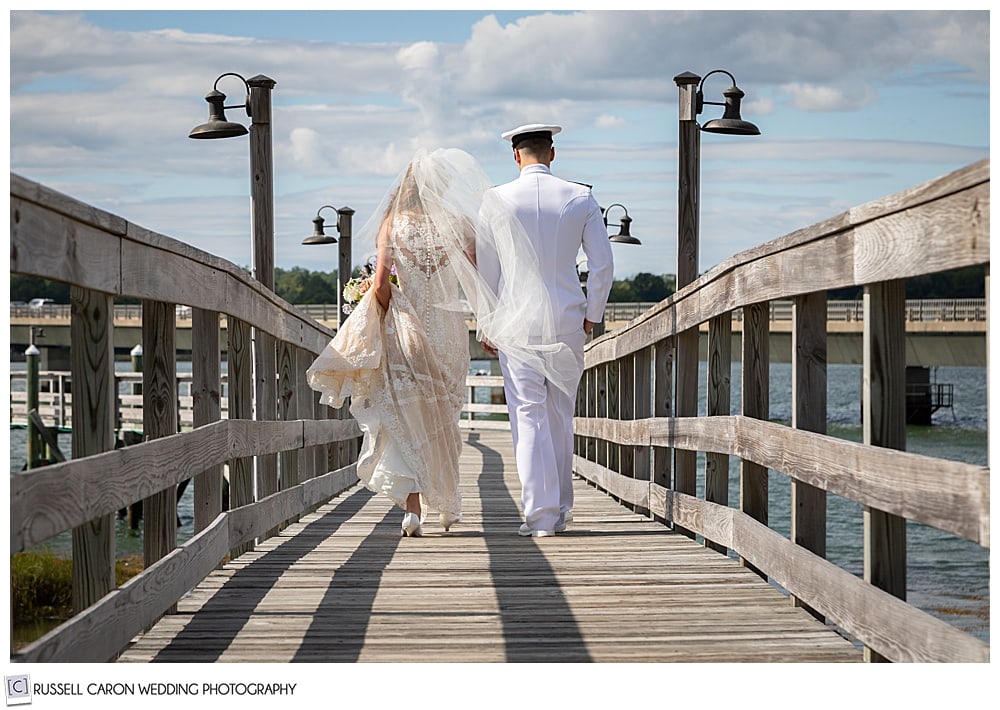 bride and groom walking down the dock at Sheepscot Harbor Village Resort