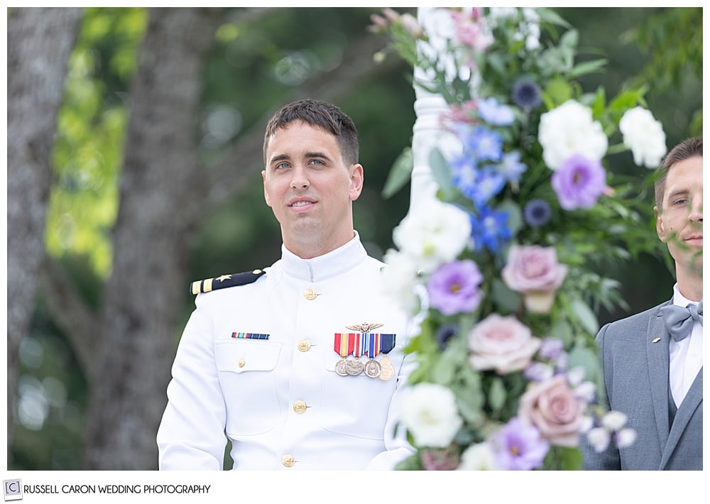 groom in dress whites waits for his bride