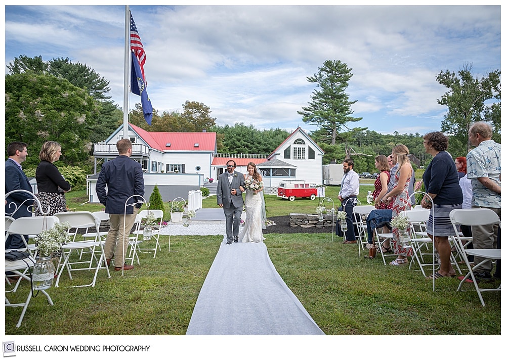 bride and her father walking down the aisle at their Maine backyard wedding