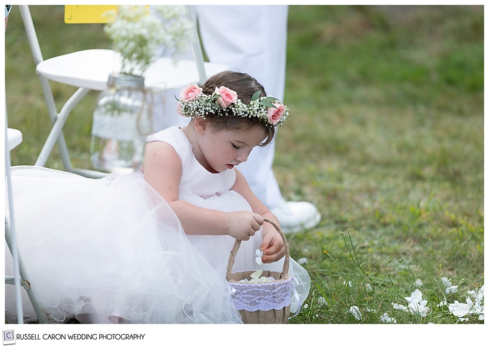 flower girls playing with flower petals