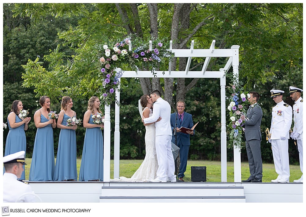 bride and groom's first kiss at their Dresden Maine wedding ceremony